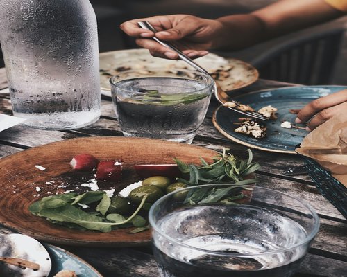 water and simple food on a table conveying calm habits